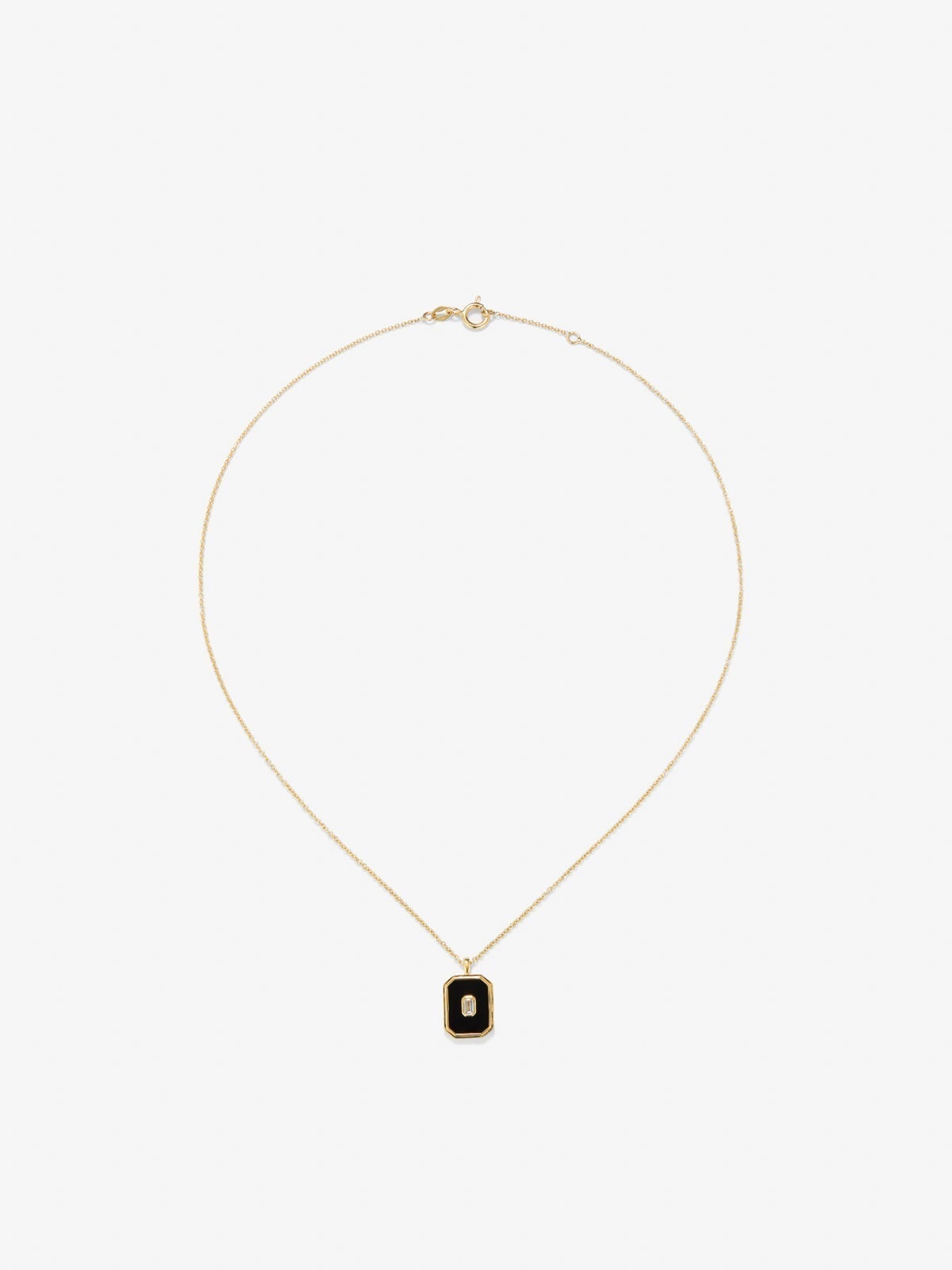 Colgante de oro amarillo de 18K con ónix negro de 1,45 cts y diamante blanco en talla esmeralda de 0,1 cts